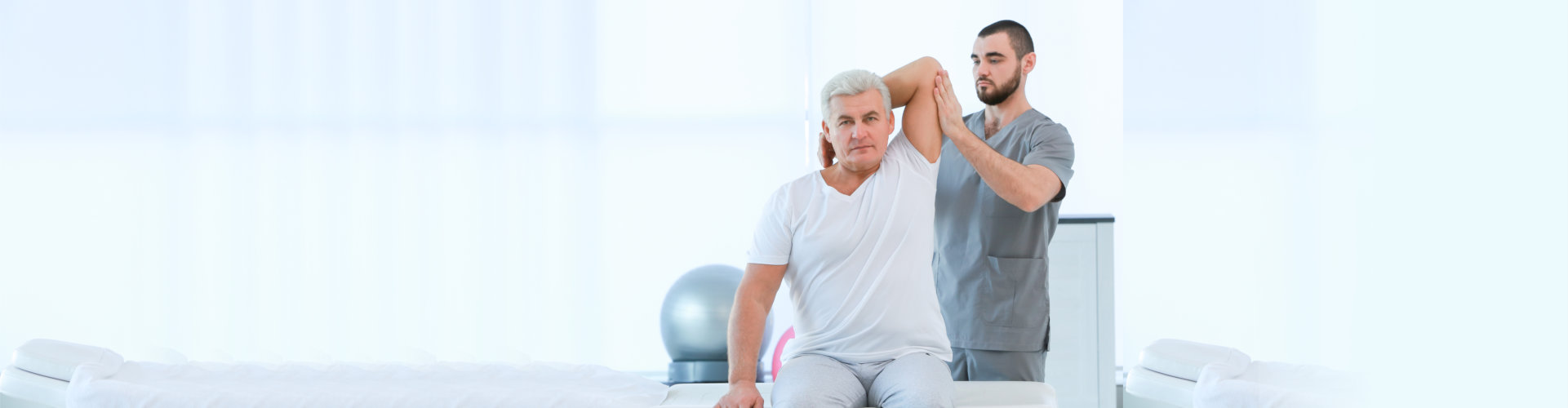 Physiotherapist working with patient in clinic