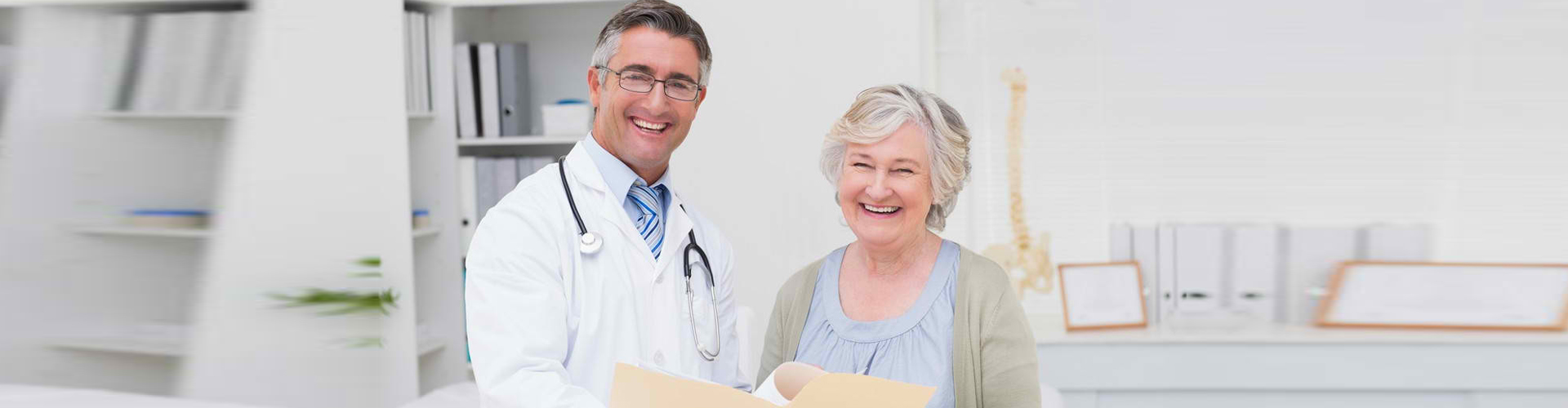 doctor and senior woman smiling