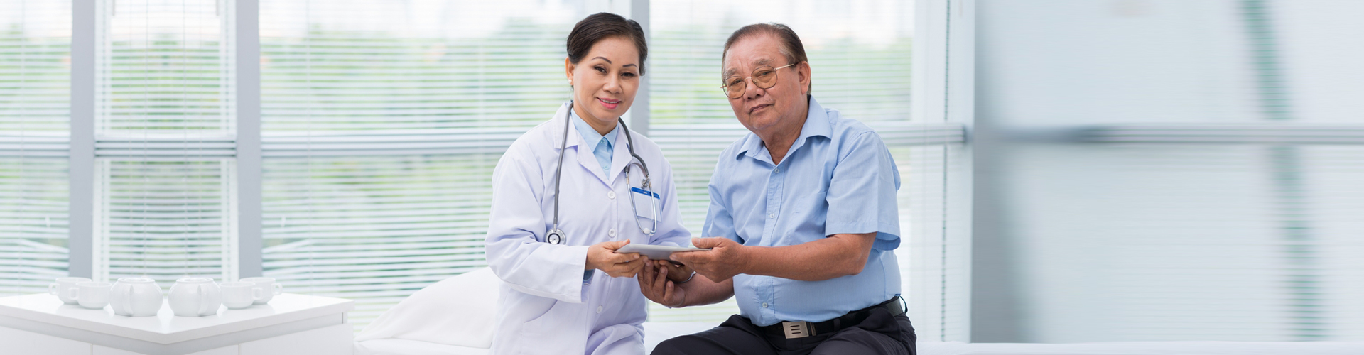 nurse and senior man smiling